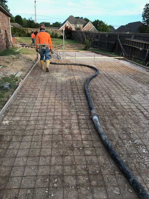 Concrete driveway being finished in Victoria, Texas